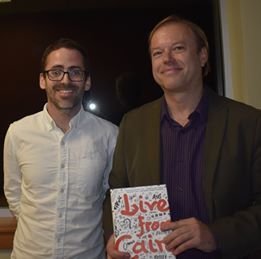 Image may contain: 2 people, including J.L. Sutton, people smiling, people standing and eyeglasses