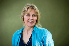 Image may contain: 1 person, smiling, close-up and outdoor