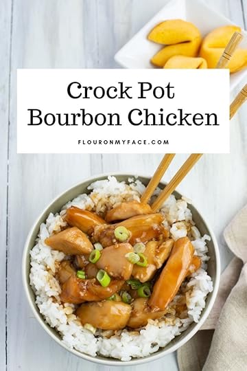 over head photo of a serving of Crock Pot Bourbon Chicken served in a bowl of cooked white rice.
