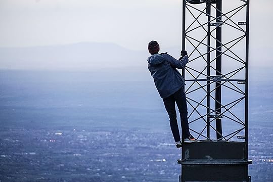 Man standing looking at mountains