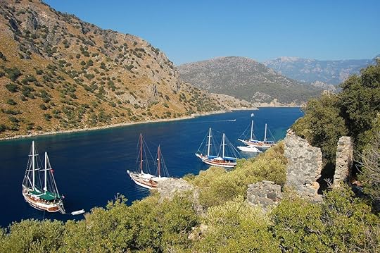 Yachts anchoring near small island on Turkish coast