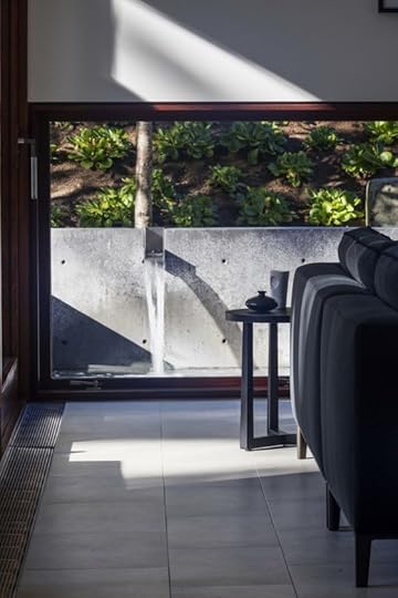 Image: interior of modern home with large glass panels