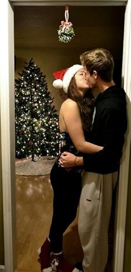 couple kissing under the mistletoe