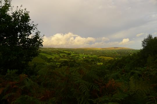 Sun breaks over the fields and moor