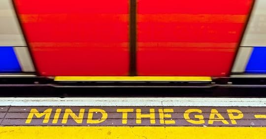Mind the Gap sign at London train station reminding employers about labor law posting