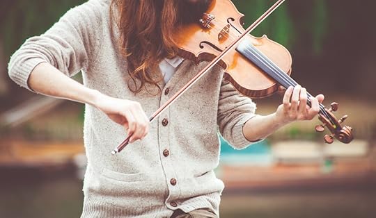 woman-in-gray-cardigan-playing-a-violin-during-daytime-111287.jpg