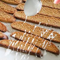 Drizzling Glaze on Gingerbread Biscotti