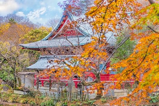 Autumn foliage overlooking a japanese temple Benzaiten in the forest parc of Inokashira in Kichijoji city