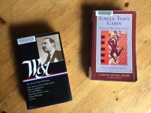 Book covers for The Day of the Locust and Uncle Tom's Cabin