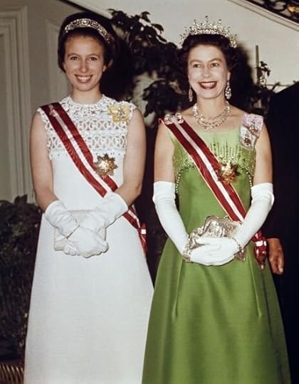 Anne wears the Meander Tiara, which was originally owned by Princess Alice of Greece and Denmark. The Queen wears the Girls of Great Britain and Ireland Tiara (so named for the group that commissioned its making).