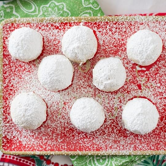 Mexican Wedding Cookies on a red holiday serving platter