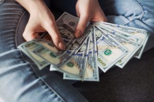 person finding ways to make more money