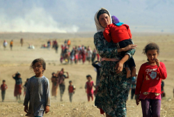 RefugeeYazidisFleeingAugust112014ReutersViaTimeMag