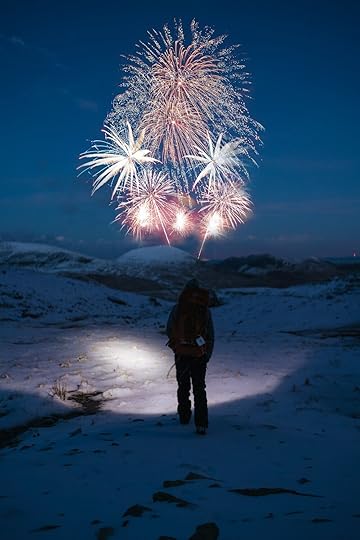 person-stands-on-snow-covered-mountain-looking-at-fireworks-767172.jpg