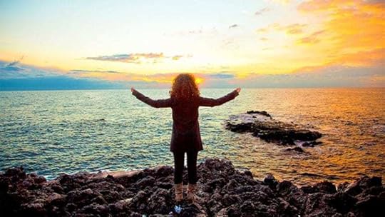 Woman greeting the sunrise
