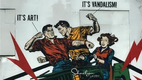 wall art battle showing conflict of interest between art and vandalism