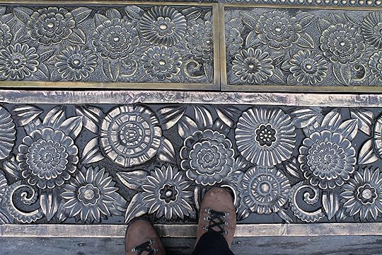 Hiking books viewed from above on ornate floor