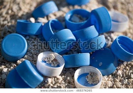plastic-bottles-cap-on-beach-600w-468376265