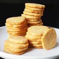 stack of cheddar cracker coins on white plate