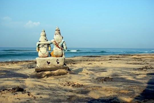Image: stone figures, arm around other's shoulder