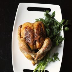 roast chicken on a white platter