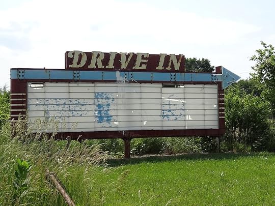 drive-in theater sign, abandoned, horizontal plane, small town, text, western script, communication, sky, plant, field | Lis'Anne Harris