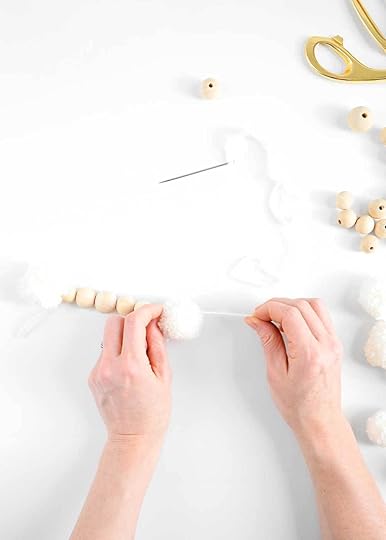 wooden bead garland with wool balls