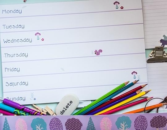 Weekly planner with coloured pencils, pens, eraser and stickers.