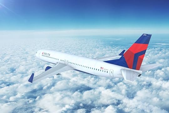 Delta airplane flying above the clouds