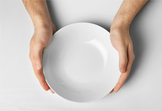 hands holding empty plate