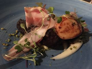 Checked in at Cava Bodega. Scallops with black pudding ��� with Jessica