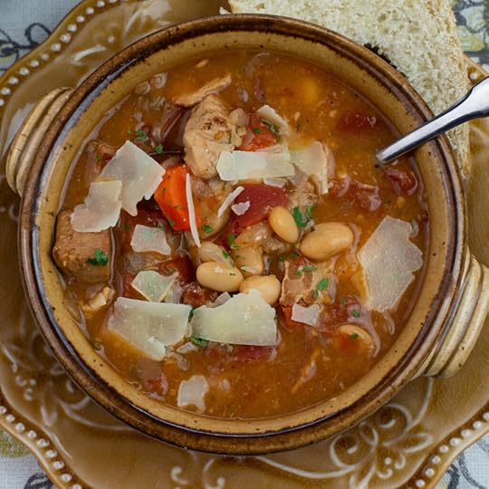 a brown crock filled with a French Pork Stew that has been slow cooked