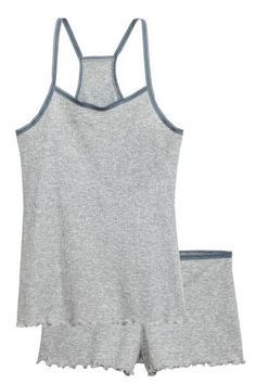 Jersey pyjama top and shorts in a ribbed cotton blend. Top with thin shoulder straps, racer back, lace trims at the top and overlocked hem. Shorts with lace
