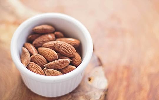 A bowl of almonds, which are high in Vitamin E.