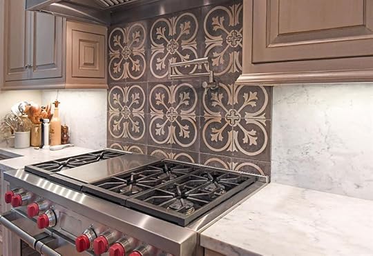 glazed cabinetry and reclaimed concrete tile over range hood