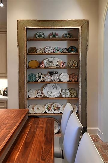 antique door turned cabinet with display plates