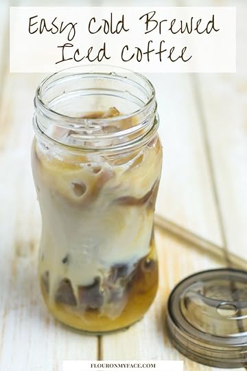 Cold Brewed Iced Coffee in a mason jar with a lid and straw.