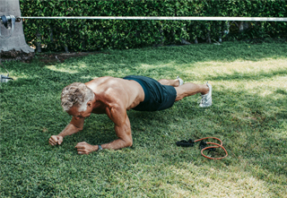 Mark Sisson doing a plank outside
