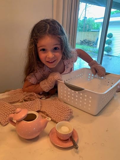 girl playing with fake snow