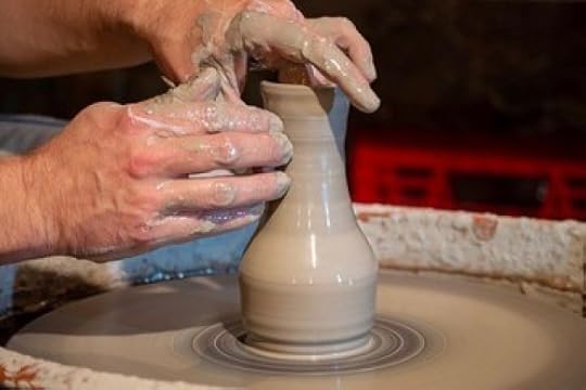 Potter working on pottery wheel
