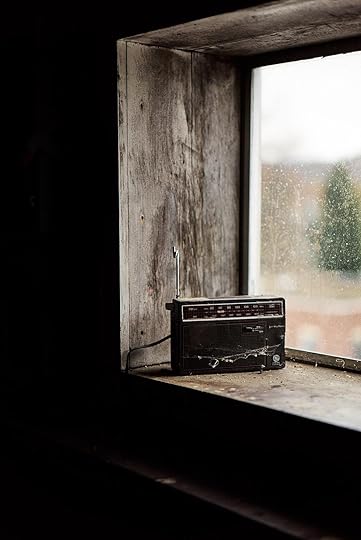 black boombox radio on top window