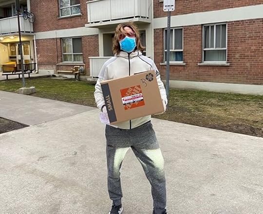 Mark Holmes , lead singer and bassist of Platinum Blonde , helps deliver food boxes across the city.