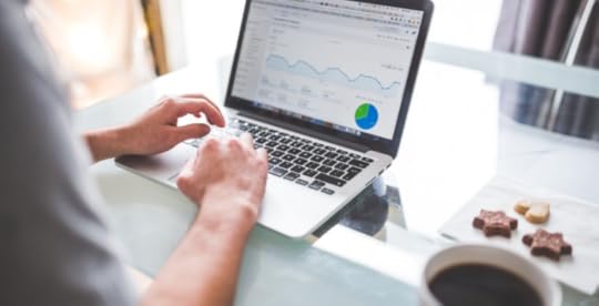 Person working on laptop at a desk at home
