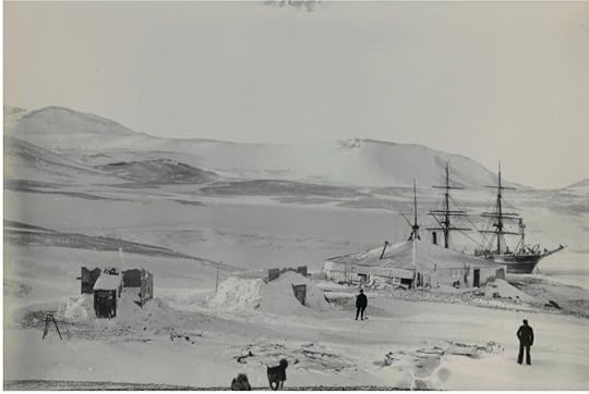 The Hut and RRS Discovery in winter quarters, with the two iron-free auxiliary huts (now gone) for magnetic work. McMurdo Station is now built on the gentle slope you see behind the Discovery ’s masts. Photo from the Royal Society collection.