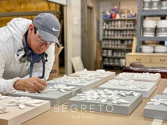 several clay mold floral art pieces getting worked on