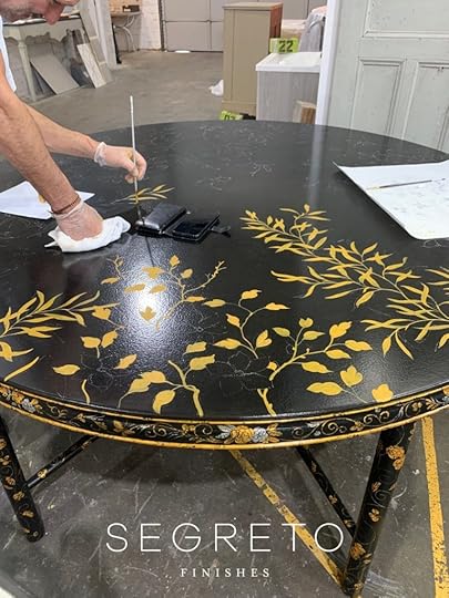 painting custom made black table with gold leaves