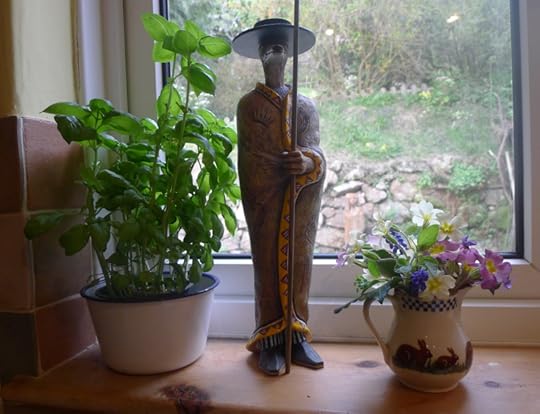 Wildflowers and Coyote in the kitchen window