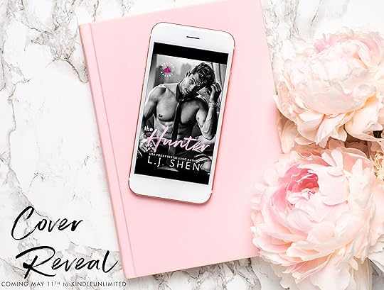 Mobile phone with a white and pink notebook and piony flowers on a marble background