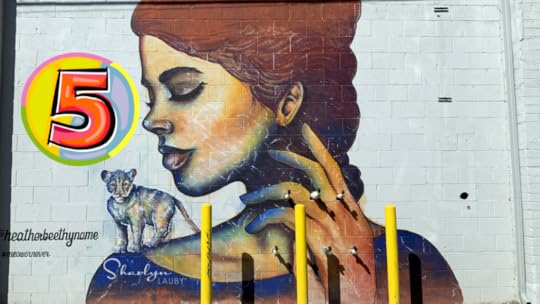 wall art young lady with baby lion on her shoulder looking at 5 HR skills