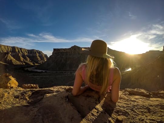 solo woman gazing at sunset in the desert